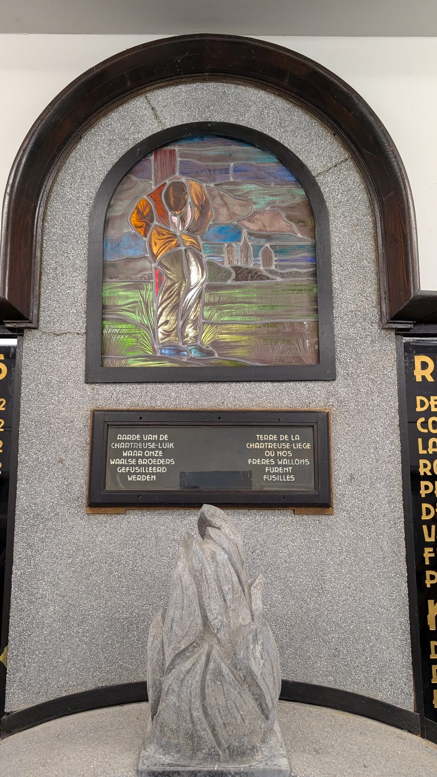 Stained-glass window and relic plaque in the memorial chapel at the Oord der Gefusilleerden, Gent.